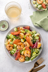 Delicious fresh salad with shrimp prawns, grapefruit, avocado, cucumber and green salad. Healthy food.