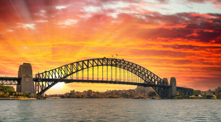 Naklejka na ściany i meble Panoramic sunset view of Sydney Harbour Bridge, Australia.