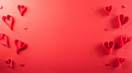 Love and Valentine's day concept made from red paper hearts on red background. Top view with copy...