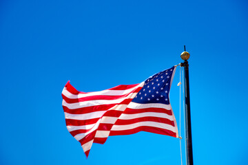 Beautiful american flag under a blue sky, USA.