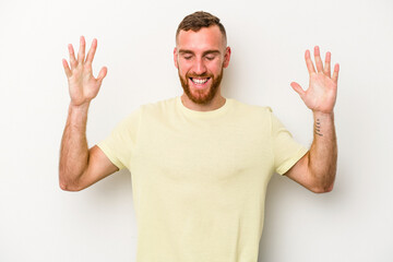 Fototapeta premium Young caucasian man isolated on white background joyful laughing a lot. Happiness concept.