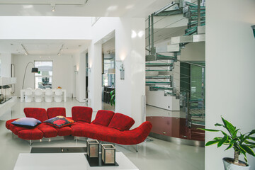 Modern interior. Luxury private house. Living room. Red sofa,