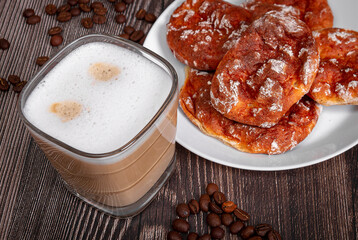 Morning breakfast cappuccino with pies on a wooden table. Morning coffee.