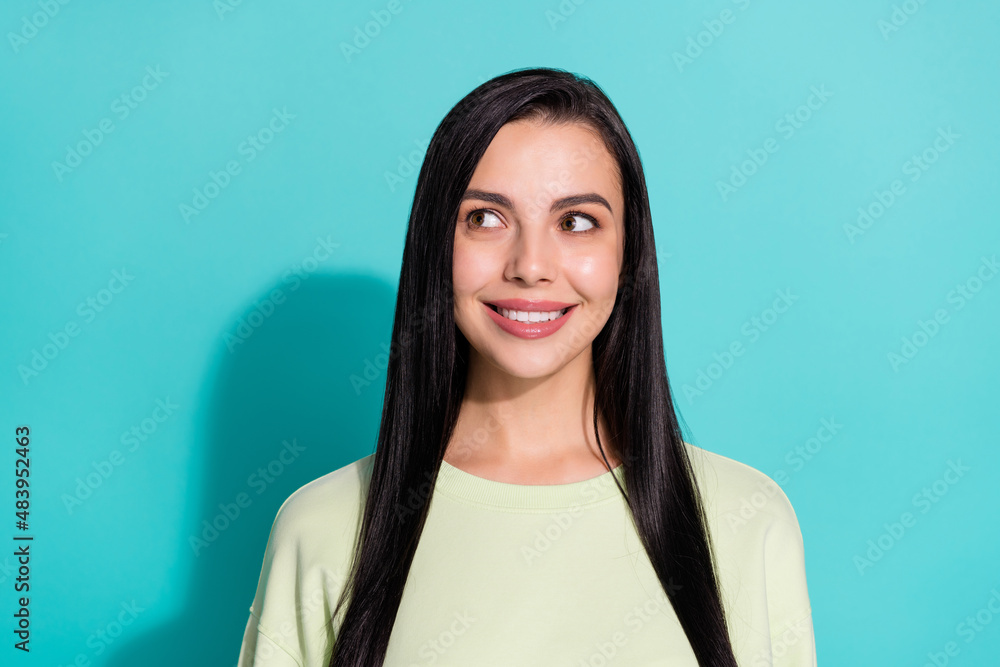 Wall mural Portrait of minded positive girl look empty space consider new adverts promotion isolated over cyan color background