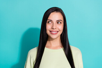 Portrait of minded positive girl look empty space consider new adverts promotion isolated over cyan...