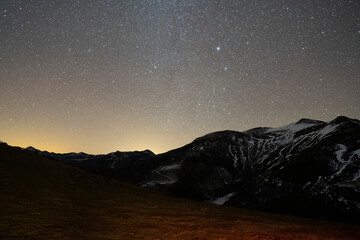 Obraz na płótnie Canvas night sky over the mountains
