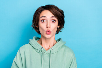 Photo of cute young bob hairdo lady look camera wear green pullover isolated on blue color background
