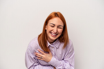 Fototapeta premium Young caucasian woman isolated on white background laughing and having fun.