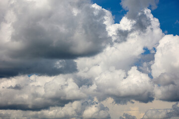 Cloudy sky, with dark clouds that bring rain and thunderstorms, smoothly float across the sky. Bad weather, cloudy mood.
