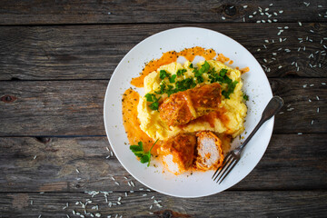 Wrapped minced meat in cabbage leaves and mashed potatoes - polish dish gołąbki
