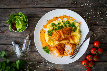 Wrapped minced meat in cabbage leaves and mashed potatoes - polish dish gołąbki
