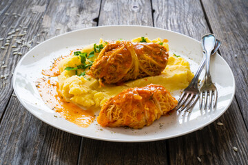 Wrapped minced meat in cabbage leaves and mashed potatoes - polish dish gołąbki
