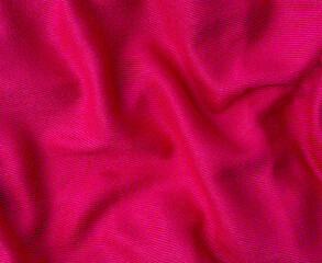 wrinkled pink fabric texture background close up