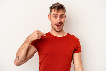 Young caucasian man isolated on white background smiling and raising thumb up