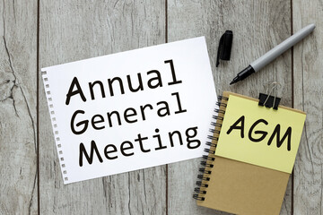 AGM symbol. Concept word 'AGM' - 'annual general meeting' Business and annual general meeting AGM concept, copy space.text on white paper