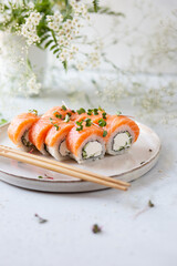 Light photo of sushi with salmon