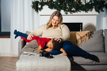 Lively mother tickling little daughter enjoy free time active weekend