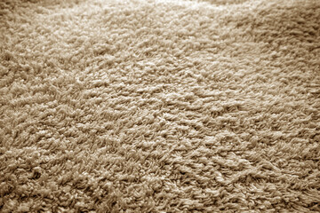 Bath towel texture with blur effect in brown tone.