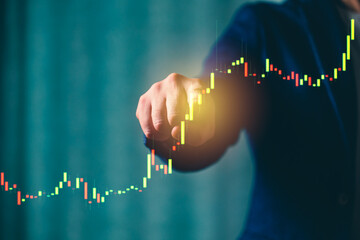 a successful investor, trader, manipulates the direction of the price of stocks, securities, the concept of investment and management, a close-up of the trader's hands