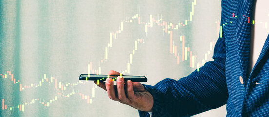 a successful investor, trader, manipulates the direction of the price of stocks, securities, the concept of investment and management, a close-up of the trader's hands
