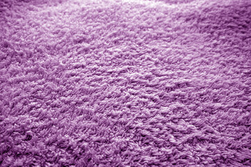 Bath towel texture with blur effect in purple tone.