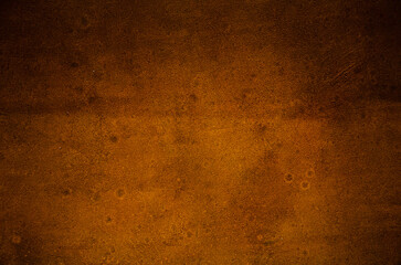 Rusty wall background. Natural rust is yellow-brown in color.