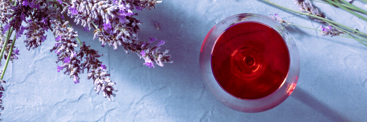 Rose wine with lavender flowers, shot from the top, a panorama for a French restaurant menu