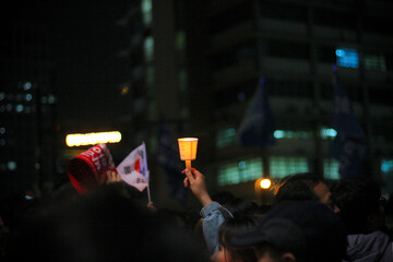 Candles in the crowd.
