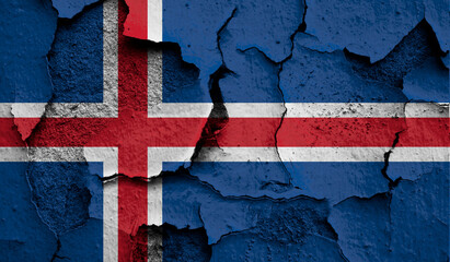 Flag of Iceland on old grunge wall in background
