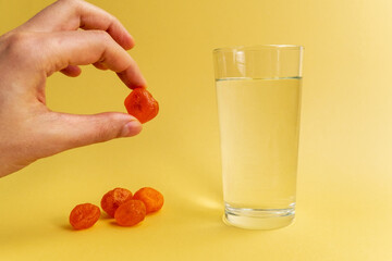 Dissolvable drinks dissolving cubes to add superfoods. On a yellowbackground