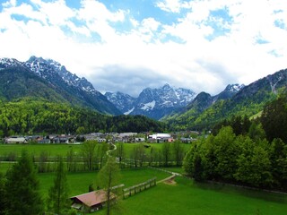 Fototapeta premium Scenic view of a small town of Kranjska Gora in Gorenjska, Slovenia bellow mountains Prisojnik and Razor