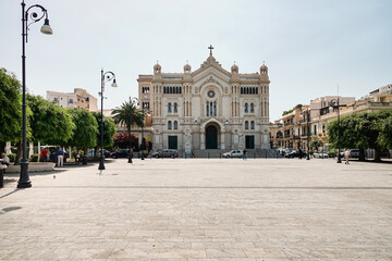 The cathedral in the historic city centre, where it shows its main façade on the wide Piazza. Reggio Calabria, Italy - July 2021