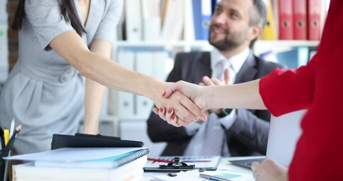 Businesswoman partners shaking hands in office at business meeting 4k movie slow motion