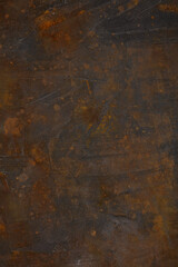 Rusty background. The texture of the dark iron cast iron sheet with rust. 