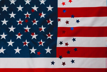 Colored shiny stars on American Flag Background. Expression of Patriotism and Love for their Country, the United States. Independence Day is July 4. Memorial Day