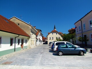 Trubarjev trg square in the town of Kranj, Slovenia with parked cars