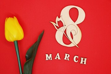 Postcard for March 8 with a yellow tulip