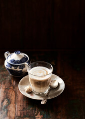 Coffee with milk on dark background. Soft focus. Copy space.
