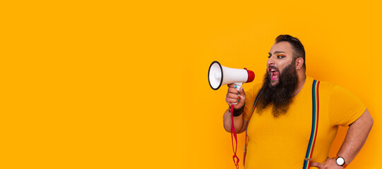 Big funny man shouting with a megaphone