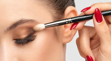 Portrait of a girl with beautiful makeup, extended long eyelashes and healthy clean skin. Makeup and cosmetology concept.