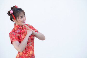 Portrait beautiful asian woman in Cheongsam dress on white background,Thailand people,Happy Chinese new year concept,Happy  asian lady in chinese traditional dress