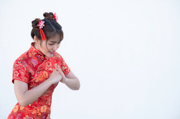 Portrait beautiful asian woman in Cheongsam dress on white background,Thailand people,Happy Chinese new year concept,Happy  asian lady in chinese traditional dress