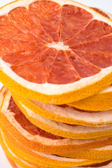 sliced ​​pieces and laid out in a pile, dried grapefruit, close-up