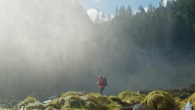 Hiking photographer takes picture of epic waterfall