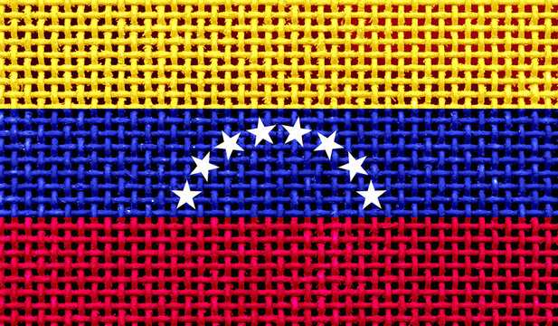 Venezuela flag on the surface of a metal lattice. 3D image