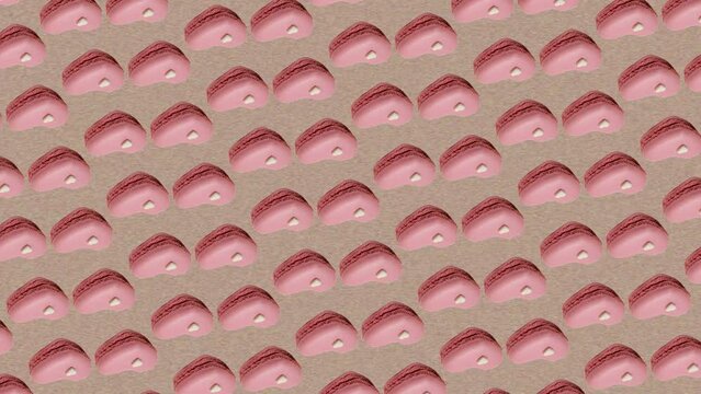 Colorful pattern of Valentine's Day themed Macaron or French macaroon in pink heart shapes isolated on trending natural beige pastel color animation background .4K Creative animation video footage.It 