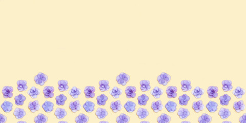 Minimal floral frame with small fresh Hydrangea violet flower, Very Peri color of year. Holiday layout with blooms for Mothers day, 8 March, Womens day. Top view, flat lay flowery fon