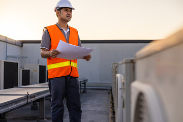 Smart civil engineer, inspectors are holding clipboard and drawing looking and working outdoors structure building site to inspect and correct the house. Inspection and checking concept.