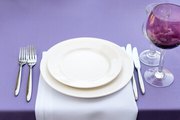 Table decorations for holidays and wedding dinner. Table set for holiday, event, party or wedding reception in outdoor restaurant.