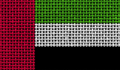  United Arab Emirates flag on the surface of a metal lattice. 3D image